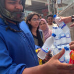 Distribution of drinking water and juice to thirsty people